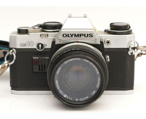 An Olympus OM10 film camera, with a Zuiko f/1.8 50mm lens.