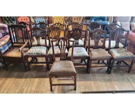 A harlequin set of twelve Edwardian dining chairs, having shaped cresting rail over splat shaped backrests, upholstered drop-