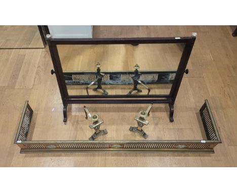 A vintage brass fire fender with rolled top and fret work detail 124cm (l) x 31cm (d) x 14cm (h), two brass fire dogs with st