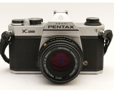 An Asahi Pentax K1000 film camera, with Pentax-M f/2 50mm lens.