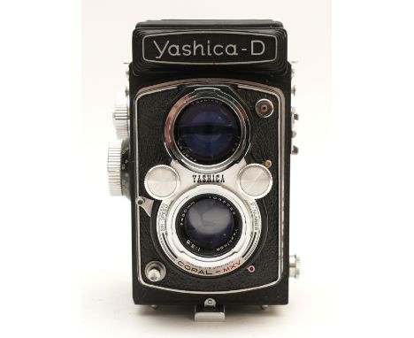 A Yashica-D TLR camera, with Yashinon f/2.8 80mm and Yashinon f/3.5 80mm lenses, serial no. D 1021035.