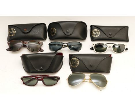 Five cased pairs of Ray-Ban designer sunglasses. 