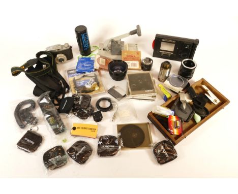 A collection of camera equipment, to include, a Hasselblad HMI 100 instant film back, a Vivanco lens, and a Cylux Luxette cam