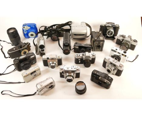 A collection of cameras and camera accessories, to include, Polaroid 300, Praktica MTL3, and Tamron AF f/4-5.6 70-300mm lens.