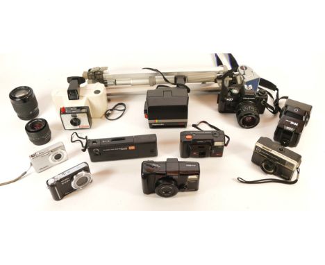 A collection of cameras and camera accessories, to include, Praktica BX20, Carl Zeiss Jena f/2.8 28mm lens, and Praktica PB f