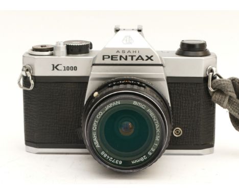 An Asahi Pentax K1000 film camera, with Pentax-M f/3.5 28mm lens.