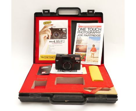 A Nikon L35 AF 2 One Touch camera, 'the complete system' set, in fitted carry case.