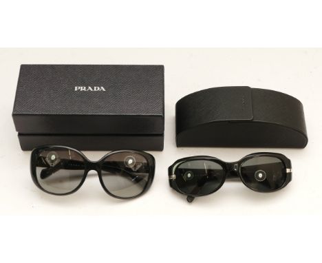 Two pairs of cased Prada designer sunglasses. (2) 
