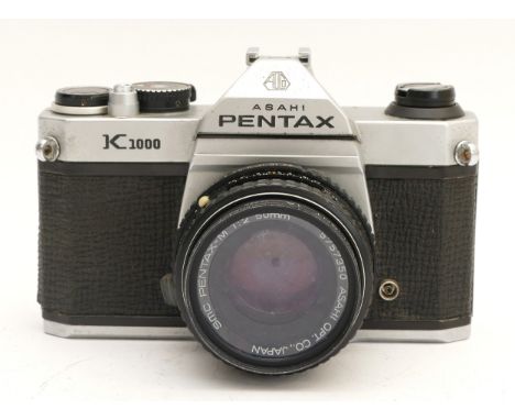 An Asahi Pentax K1000 film camera, with Pentax-M f/2 50mm lens.