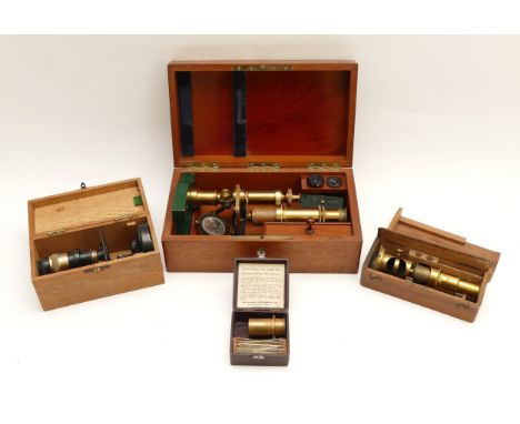 An early 20th century microscope in fitted mahogany case, together with two smaller examples and a Midgard pocket microscope.