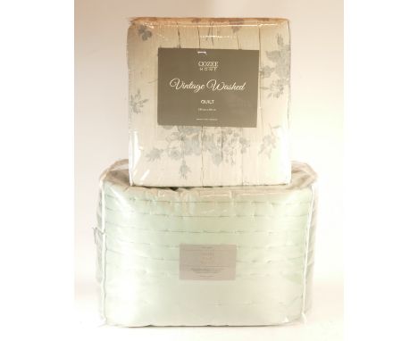 John Lewis Hotel Silk quilt, pale blue, king size. Together with a Cozee Home vintage washed, king size, blue floral quilt. (