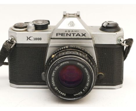 An Asahi Pentax K1000 film camera, with Pentax-M f/2 50mm lens.