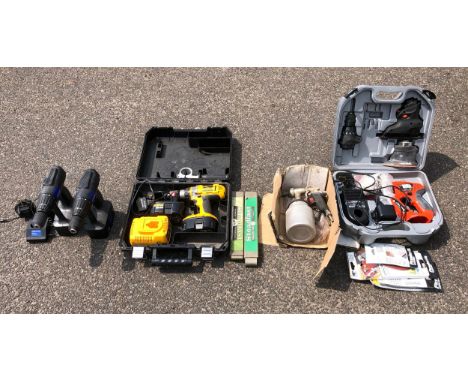 A boxed Asturo air paint spray gun, two packs of Steadfast hacksaw blades, a boxed DeWalt DC988 18vbattery drill with two bat