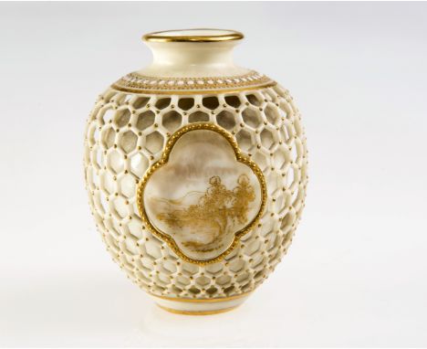 A ROYAL WORCESTER RETICULATED VASE, of baluster form, gilt painted with three landscape vignettes visible through a reticulat