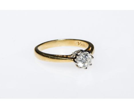 A DIAMOND SOLITAIRE RING, the round brilliant-cut stone weighing 0.50 carats, claw set on an 18ct yellow gold band. Ring size