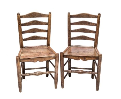 A PAIR OF 19th CENTURY OAK LADDER BACK CHAIRS, each with a plank seat raised on circular section tapering legs joined by turn