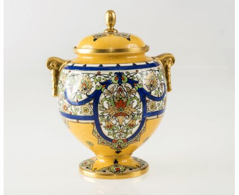 A STRIKING ROYAL WORCESTER VASE AND COVER, enamel painted with stylised flowers against a yellow ground, highlighted with gil