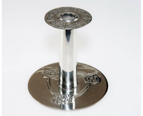 A TUDRIC PEWTER LIBERTY & Co. CANDLESTICK BY ARCHIBALD KNOX, the drop in drip tray with Celtic Knot decoration on a cylindric