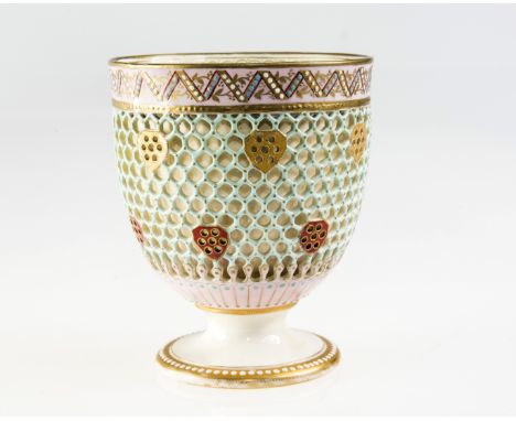 A ROYAL WORCESTER RETICULATED VASE, c.1880, designed by George Owen, of pedestal cup form, double walled with external sleeve