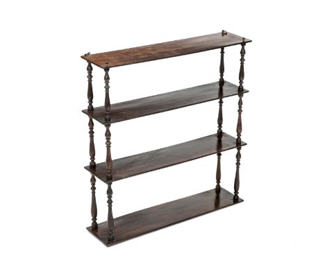 A THREE TIER MAHOGANY HANGING SHELF, each shelf supported by turned uprights, fitted with brass ring hooks. 0.69m by 0.65m by