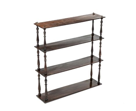 A THREE TIER MAHOGANY HANGING SHELF, each shelf supported by turned uprights, fitted with brass ring hooks. 0.69m by 0.65m by