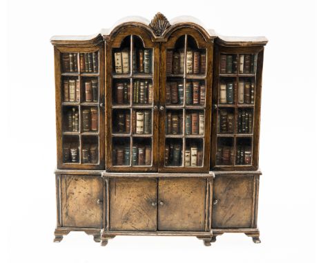 A WALNUT-VENEERED MINIATURE BREAKFRONT BOOKCASE, PROBABLY FOR A DOLL'S HOUSE, early 20th century, with double-domed centre, t