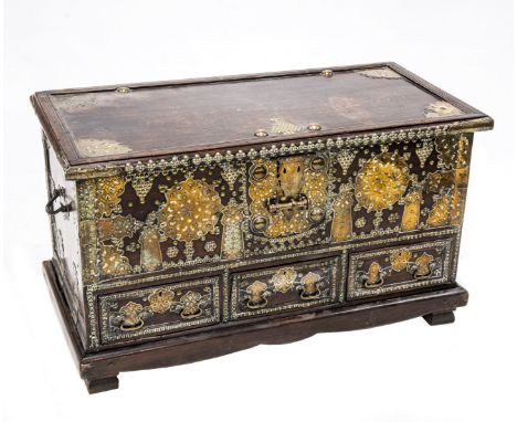 A ZANZIBAR BRASS MOUNTED HARDWOOD CHEST, EARLY 19th CENTURY, the hinged rectangular top over three short drawers, the carcass