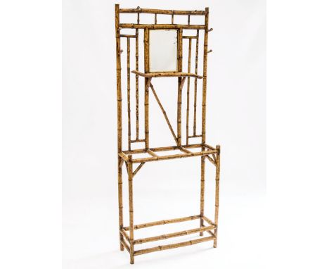 A 19th CENTURY BAMBOO HALL STAND IN THE AESTHETIC TASTE, centred by a small bevelled mirror plate over a three section stick 