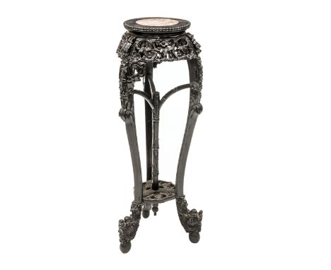 A CHINESE PADOUK WOOD MARBLE INSET PLANT STAND, c.1900, the circular marble inset top over an elaborate foliate carved frieze