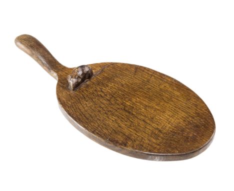 AN EARLY ROBERT MOUSEMAN THOMPSON OAK CHEESE BOARD, with a carved mouse signature below the handle. length 37cm 
