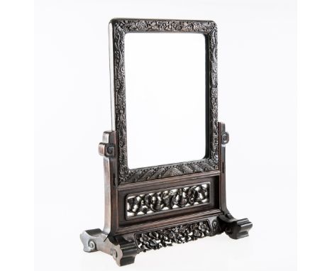 A 19th CENTURY CHINESE HARDWOOD TABLE MIRROR, with carved frame and scroll carved and pierced stand, with bevelled glass plat