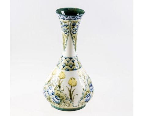 A LARGE WILLIAM MOORCROFT FOR JAMES MACINTYRE, FLORIANWARE VASE, of flask form, decorated in relief slip with forget-me-nots 