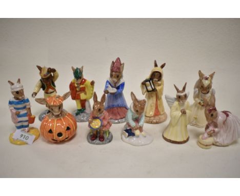 Eleven Royal Doulton Bunnykins figure studies including Girl Skater, Sands of Time, Sundial, Bride, Mother, Buntie, Helping M