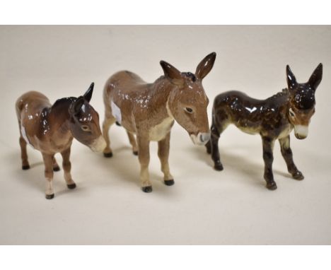 Three figure studies including Beswick Donkey 2267A, 1346B, a Goebel Donkey CE314