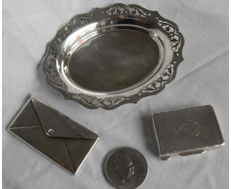 A Birmingham silver stamp or card holder in the form of a hinged envelope, 1.1 oz; a Continental silver powder box with engin