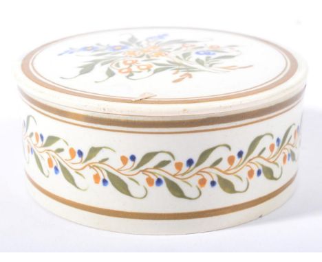 A Prattware Circular Snuff Box and Screw Top, circa 1800, typically painted with stylised flowers within line borders, 8cm di