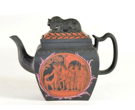A Black Basalt Teapot and Cover, circa 1810, of bombé rectangular form with recumbent lion finial, painted in orange with cla