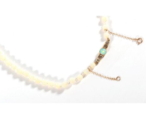 An Opal and Rock Crystal Bead Necklace, with a Diamond and Opal set Clasp, graduated opal beads, spaced by faceted rock cryst