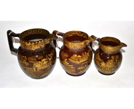 A Graduated Set of Three Nelson Commemorative Brown Glazed Pottery Jugs, circa 1805, printed in yellow with a bust portrait a