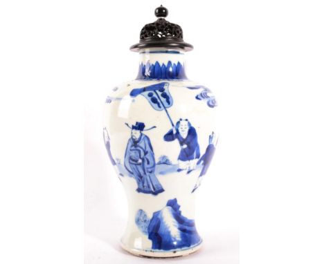 A Chinese Porcelain Baluster Vase, in Kangxi style, painted in underglaze blue with a procession, 24cm high, with hardwood co