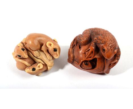 A Japanese Boxwood Netsuke, Meiji period, carved as toads on a fruit, signed, 4cm wide; and A Similar Tagua Nut Okimono, as r