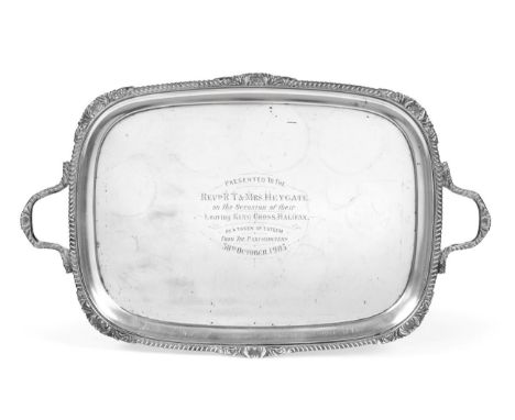 A Large Edwardian Silver Twin Handled Tray, Goldsmiths &amp; Silversmiths Co, London 1905, with gadroon, foliate and shell ri