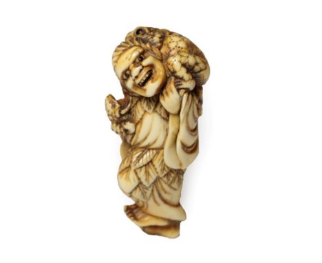 A Japanese Ivory Netsuke, Edo period, as Gama Sennin standing holding a baby toad, the toad on his shoulders, 7.5cm high  Wit