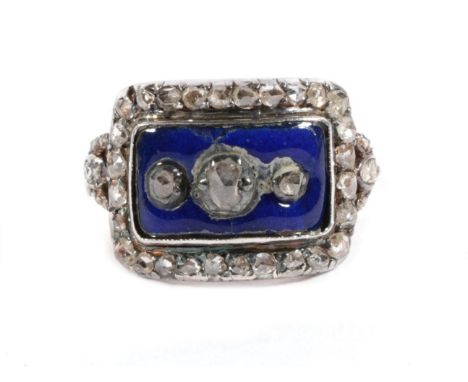 A Blue Enamel and Rose Cut Diamond Mourning Ring, three graduated rose cut diamonds within a blue enamel rectangular plaque w