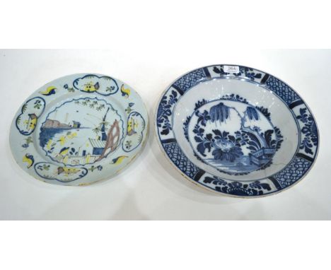 An English Delft Dish, circa 1760, painted in colours with a fenced garden within panelled borders, 31cm; and A Similar Basin