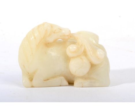 A Chinese Carved Jade Figure of a Horse, in Ming style, recumbent with a cat, 7cm wide