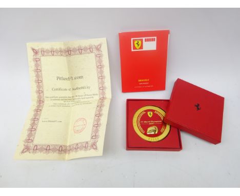 Ferrari 2007 medal paperweight, in original box, 06 Brazil GP Ferrari programme signed by Michael Schumacher, with certificat