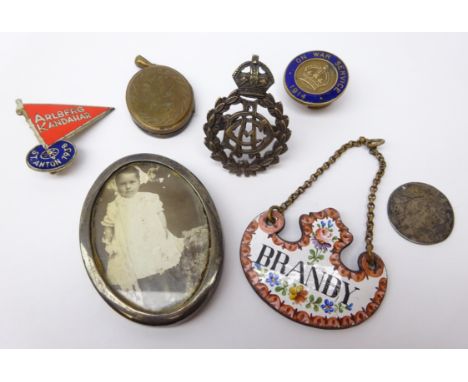 19th century enamel 'Brandy' decanter label, Royal Army Dental Corps cap badge, 1914 On War Service badge, Victorian locket, 