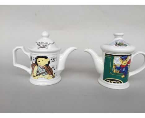 A Locomotive Joe Wade teapot together with another Wade teapot pot called Musical Marco both 17 cm H