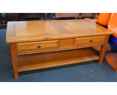 An oak coffee table with four drawers with under shelf 47 x 60 x 120cm